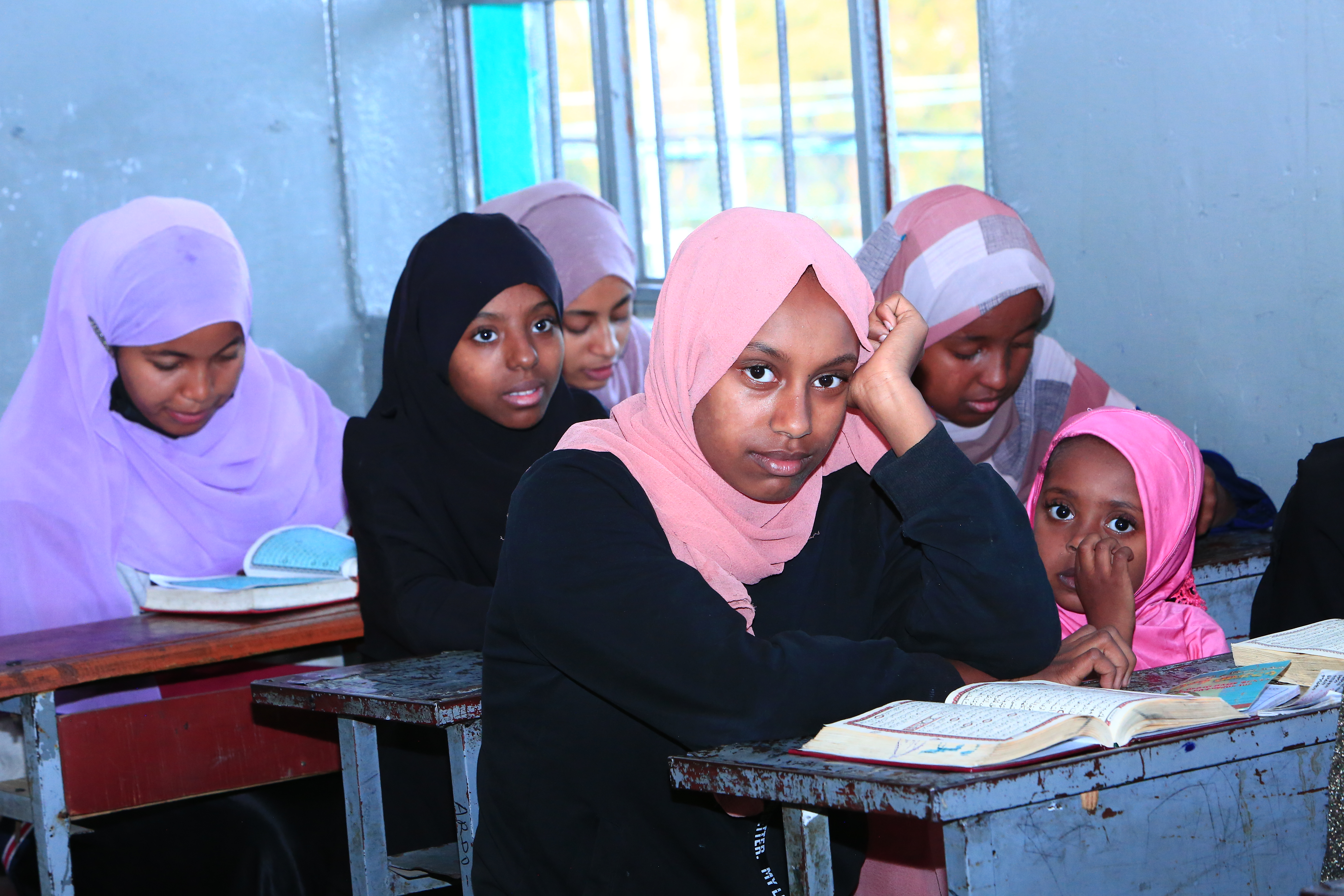 Students learning Quran in a classroom